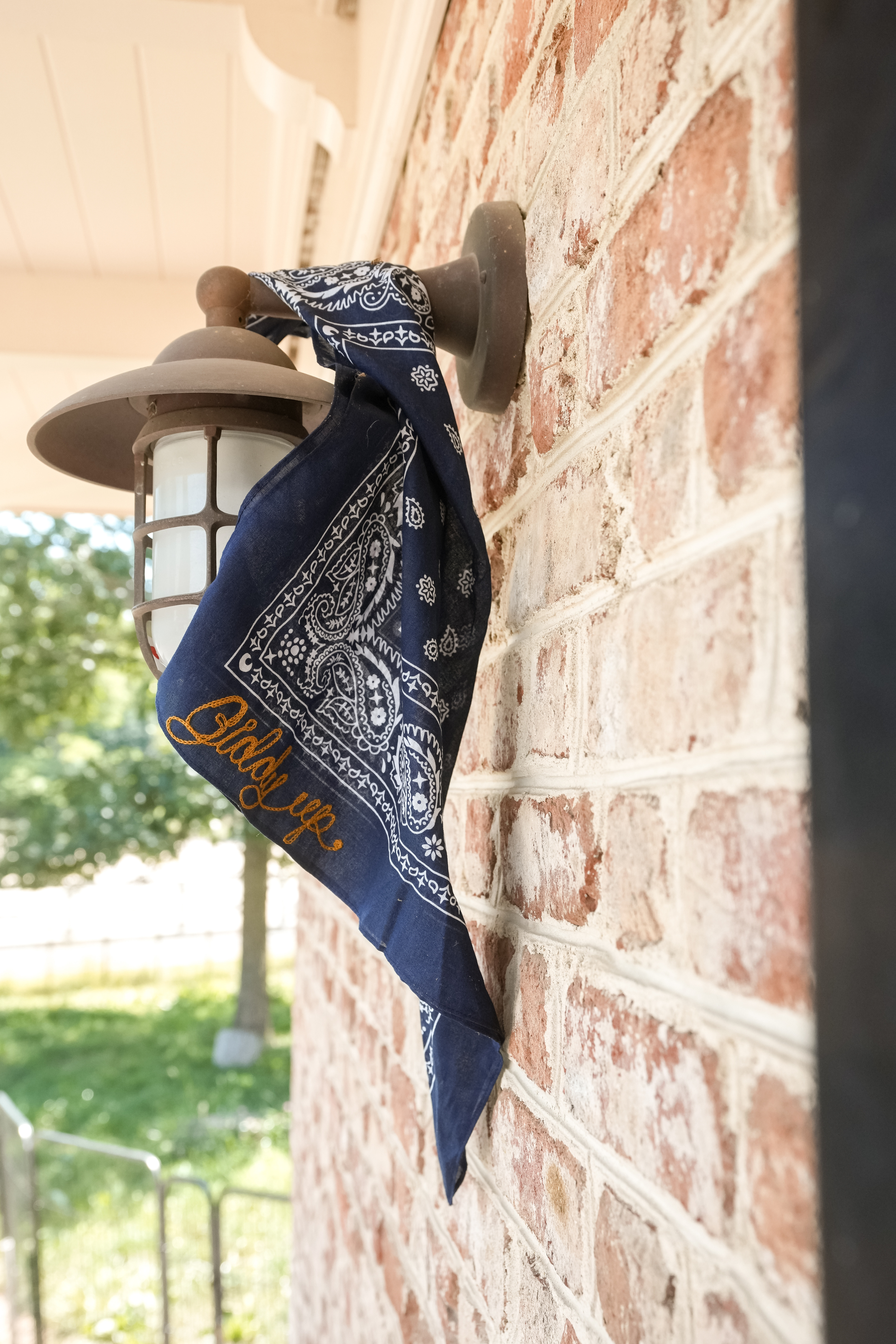 Navy western bandana with gold Giddy Up embroidery.