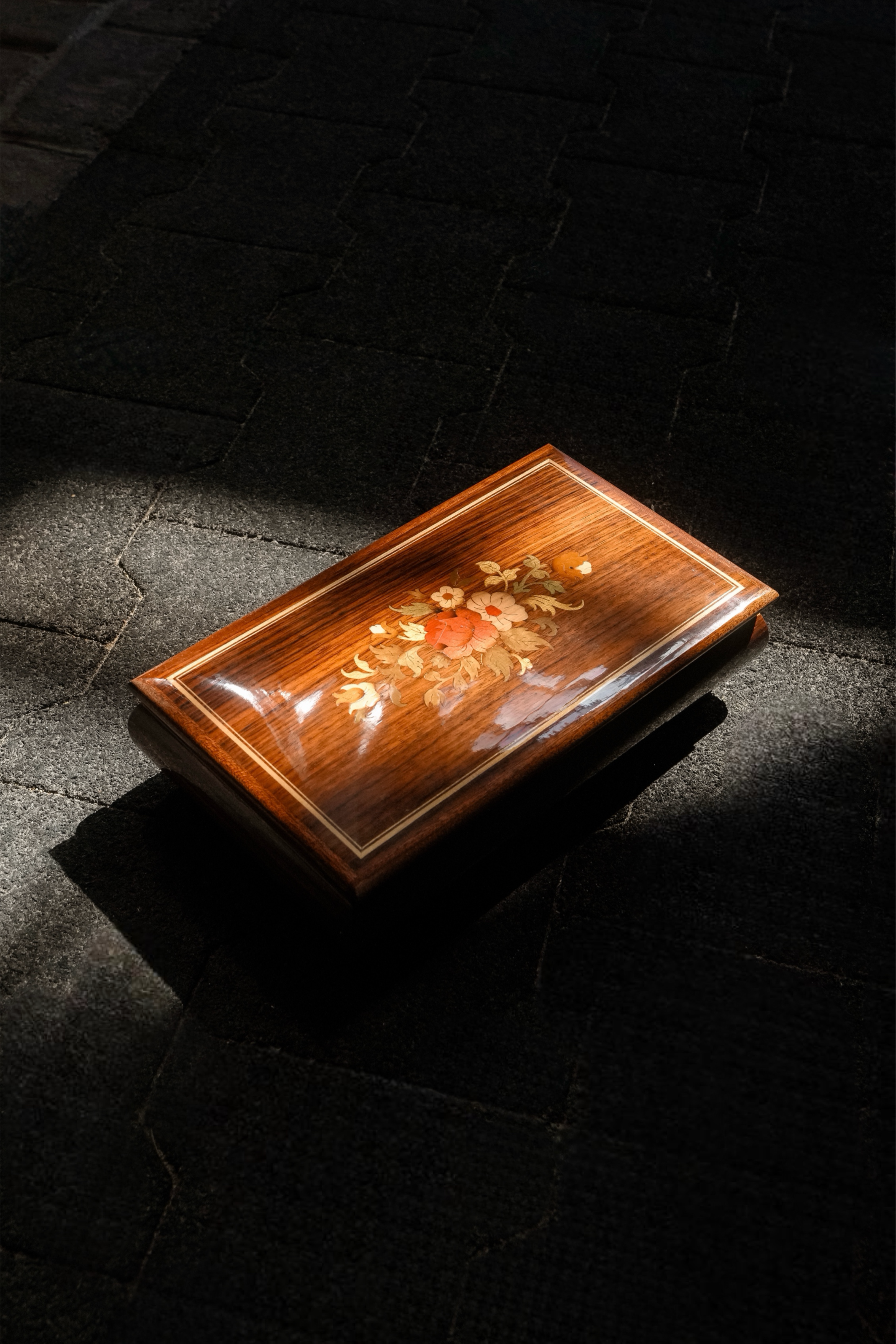 Vintage Made in Italy wooden Sorrento music box with floral marquetry inlay and curved lid.
