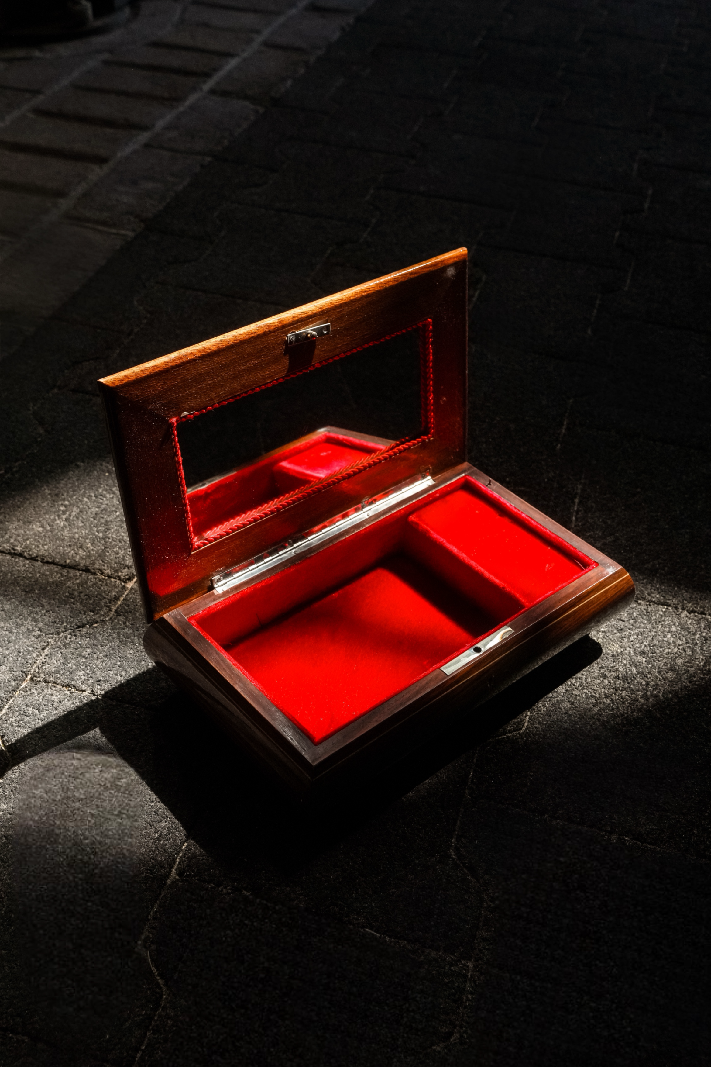 Vintage Italian Sorrento marquetry music box open with red velvet interior, mirrored lid, and Swiss movement.
