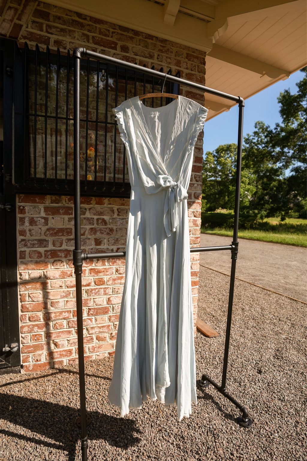 Antique blue silk gown with lace trimmed hem