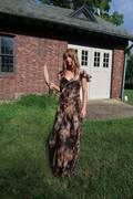 Ralph Lauren Collection Brienne crinkle chiffon gown in a dark romantic floral print, featuring cascading ruffles, a V-neckline, and a floor-length silhouette.