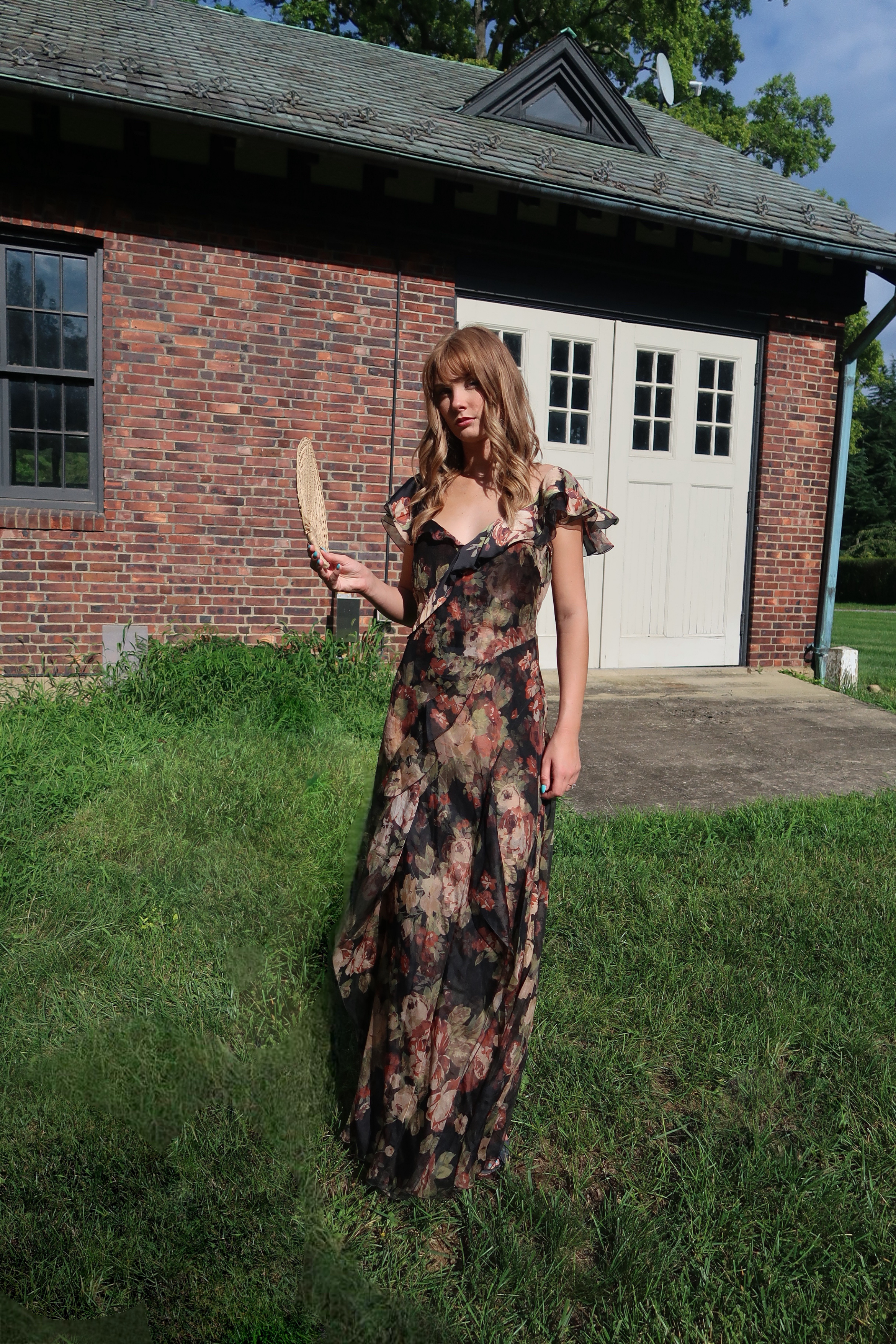 Ralph Lauren Collection Brienne crinkle chiffon gown in a dark romantic floral print, featuring cascading ruffles, a V-neckline, and a floor-length silhouette.