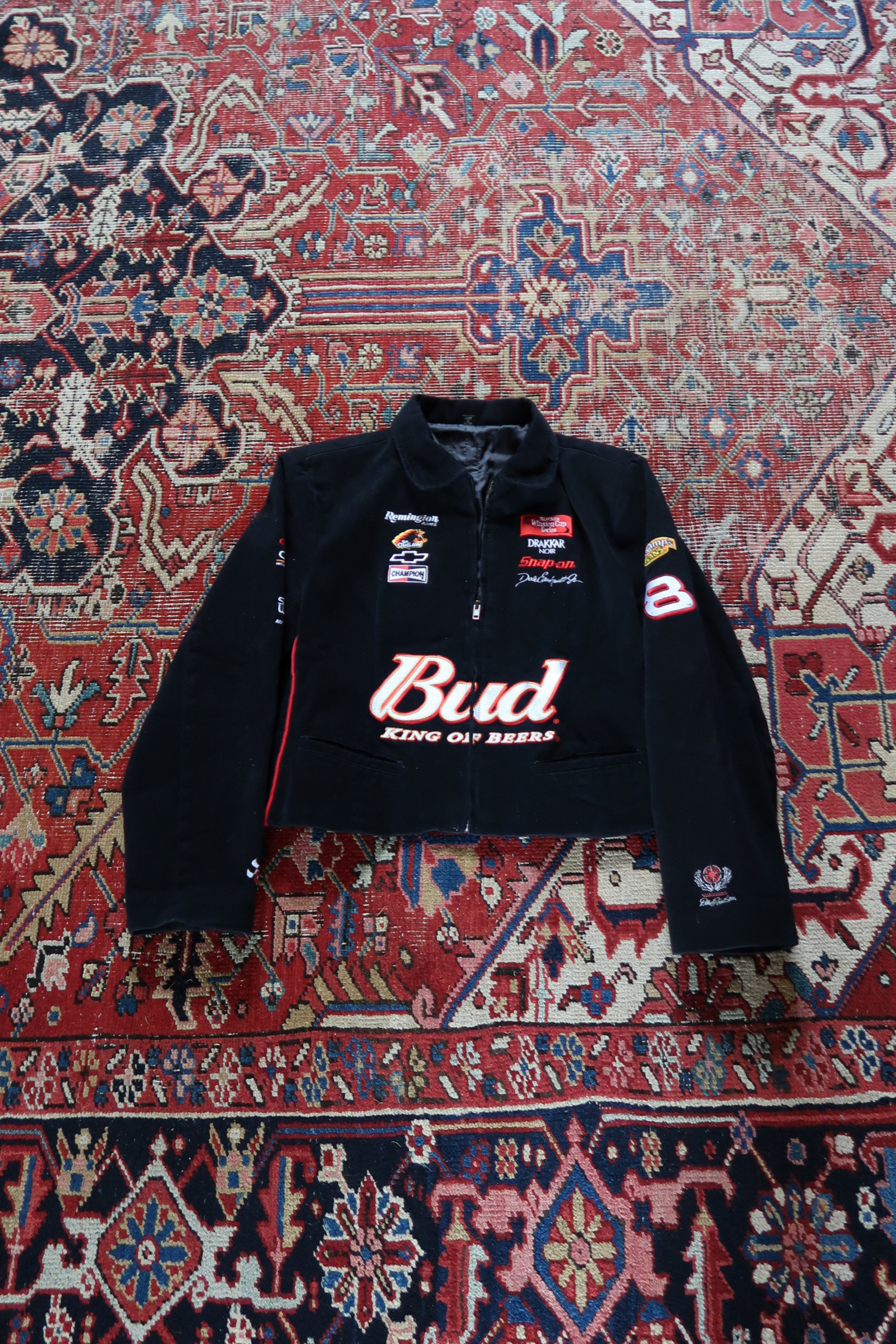 Vintage Dale Earnhardt Jr Budweiser NASCAR racing jacket in black with embroidered sponsor logos and red piping