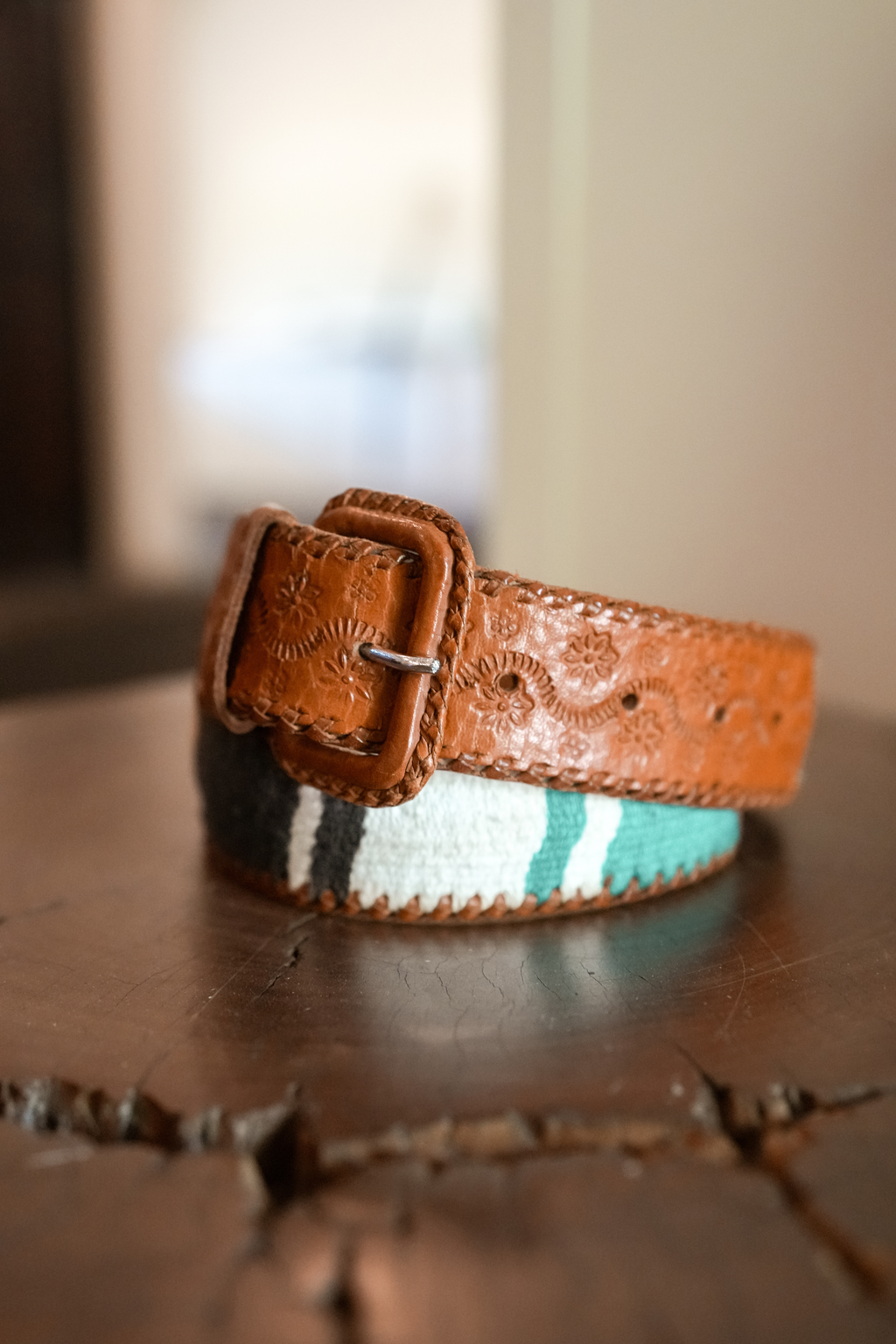 Vintage Guatemalan hand-tooled leather and colorful woven textile belt with leather-covered buckle.