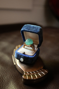 Vintage 14K yellow gold cocktail ring with carved jade floral cabochon and blue sapphire accents